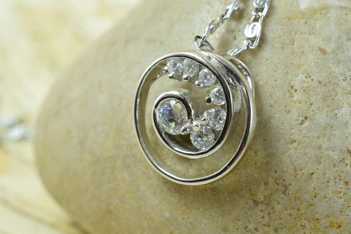 Spiral swirl white gold rhodium plated pendant cubic zirconia pink/clear