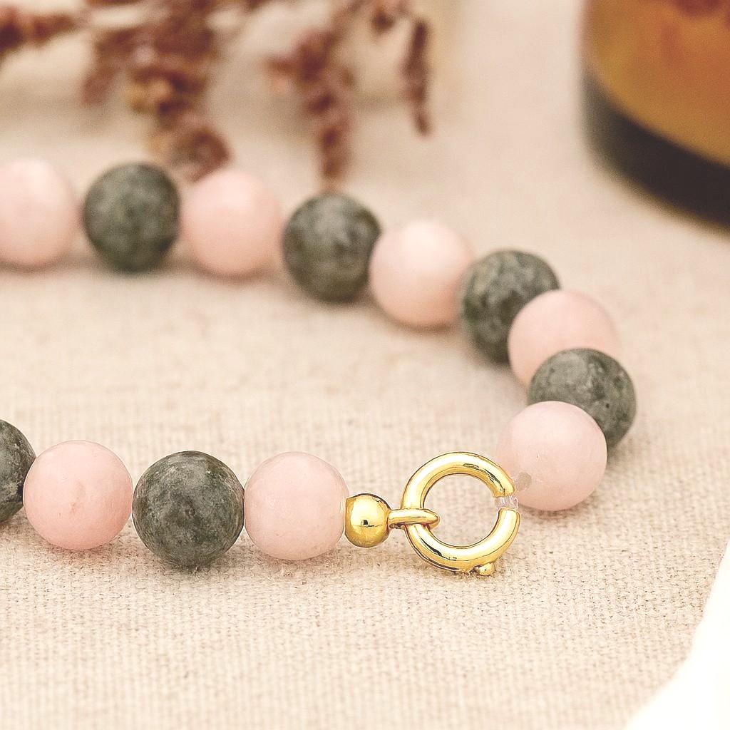 bracelet with a polished gold-tone crimp cover neatly hiding the knot at the end.