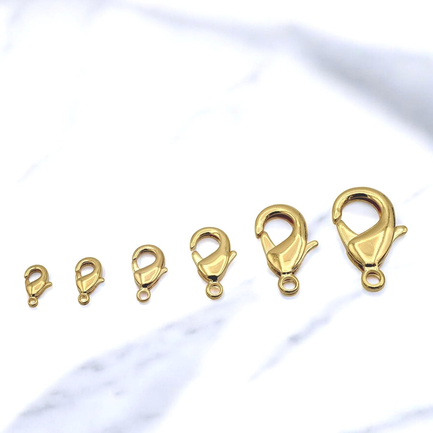 Close‑up of 18K gold filled lobster clasp in 4x9mm size for jewelry making