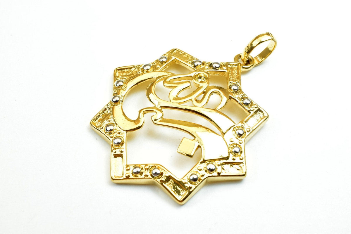 Gold star-shaped pendant with crystal accents on white background.