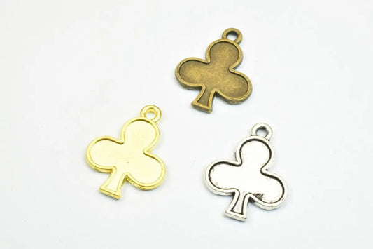 Three casino club suit charms in gold, bronze, and silver finish.