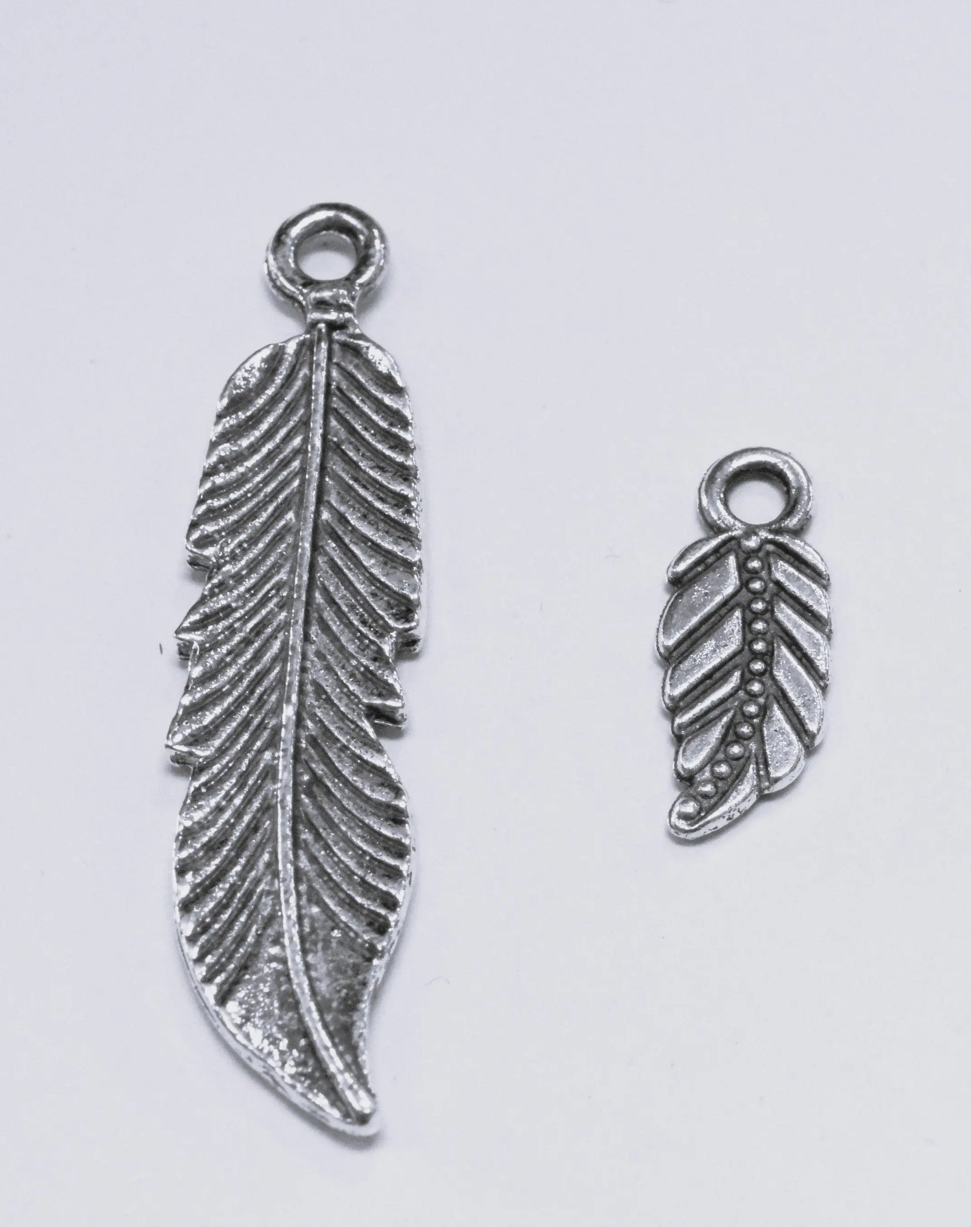 Antique Silver Tropical Textured Leaf Pendant small and big charm 43x10mm/18x7mm Sold by pack Findings for Jewelry making and Wholesale - BeadsFindingDepot