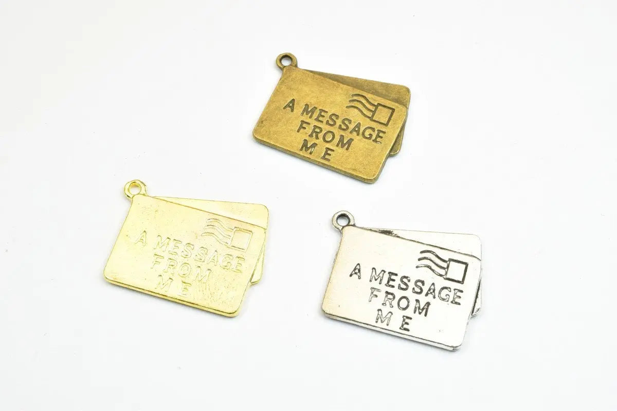 Gold and silver letter envelope charms with "A Message From Me" engraving.