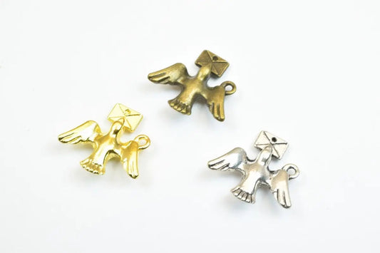 Gold, bronze, and silver bird charms with envelope design.