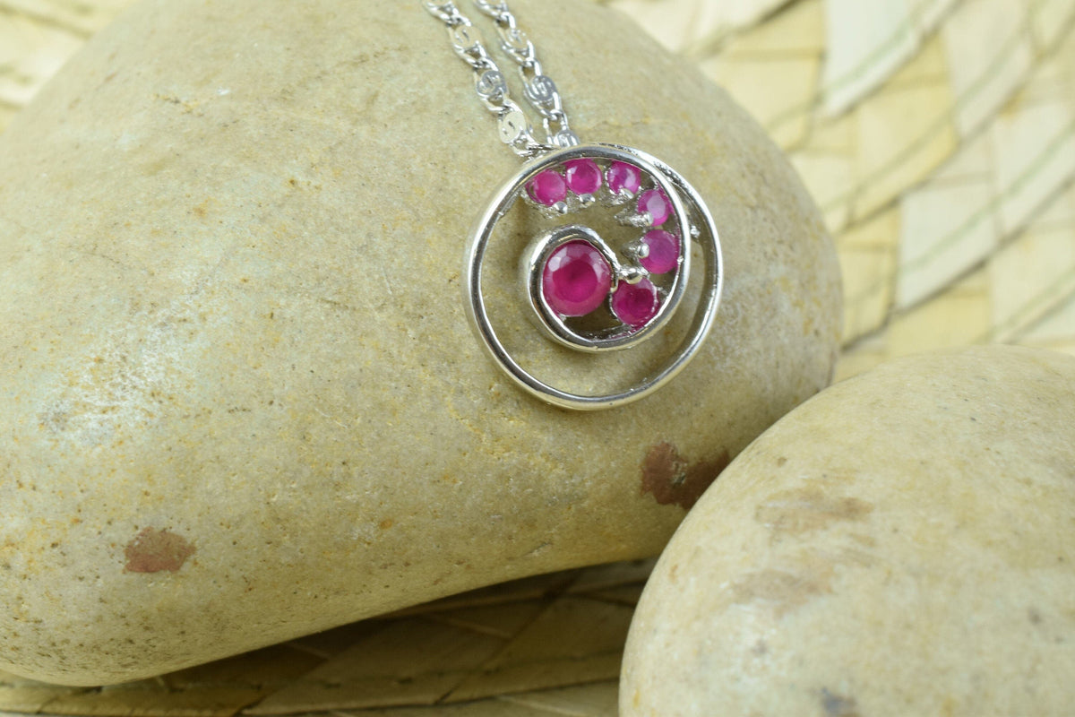 Spiral swirl white gold rhodium plated pendant cubic zirconia pink/clear