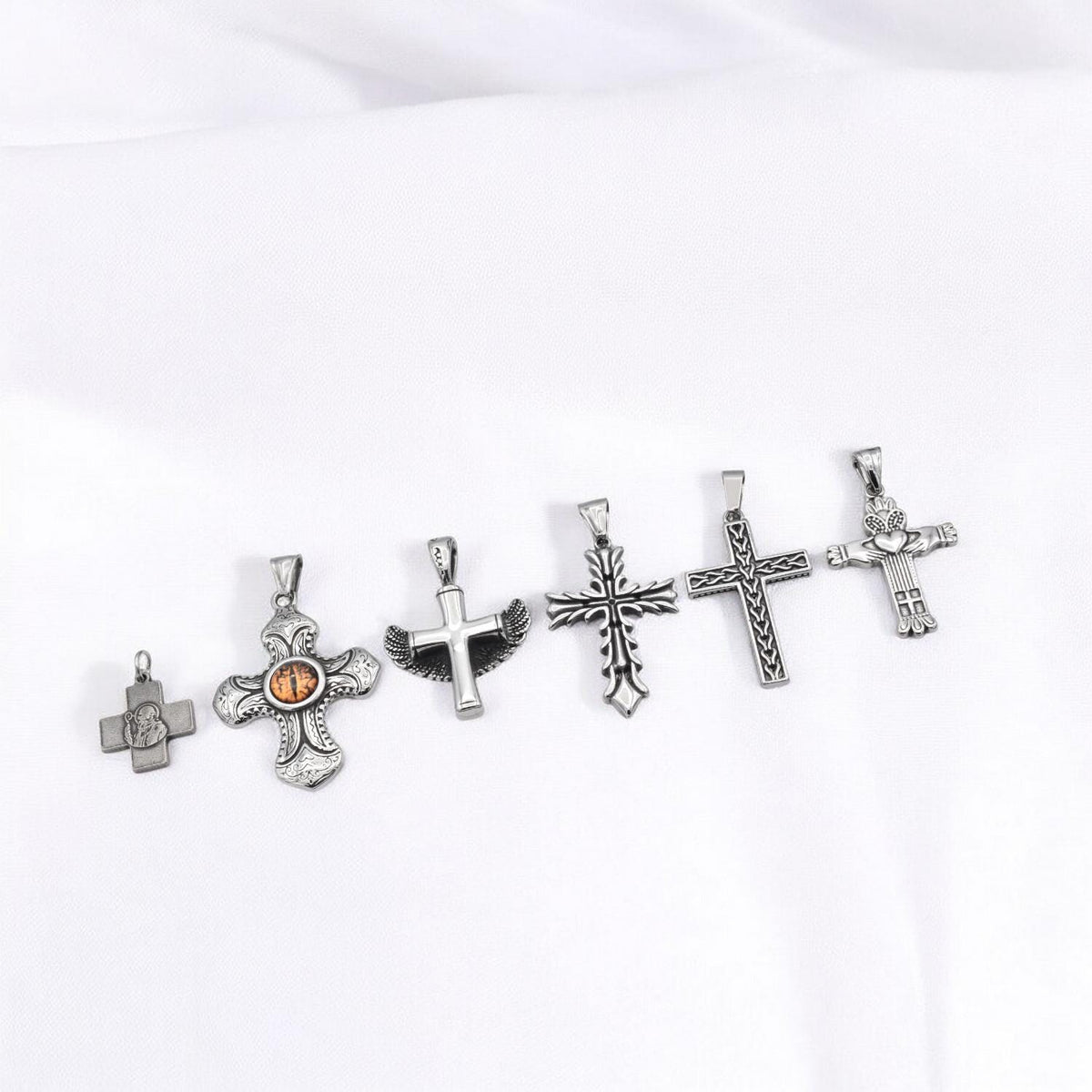 Stainless Steel Cross Pendants for necklaces, jewelry making, and crafts reptile eye cross, wing cross, heart cross, etc....