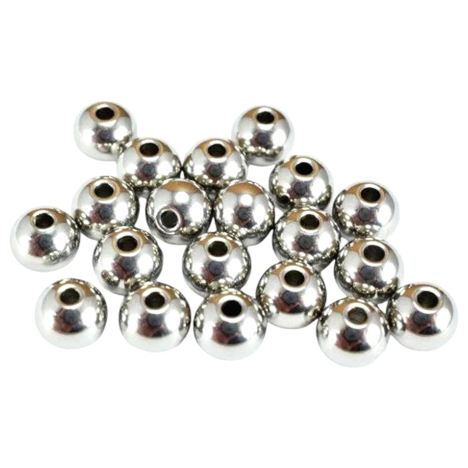 Macro shot of smooth stainless steel beads showing mirror-like polished finish