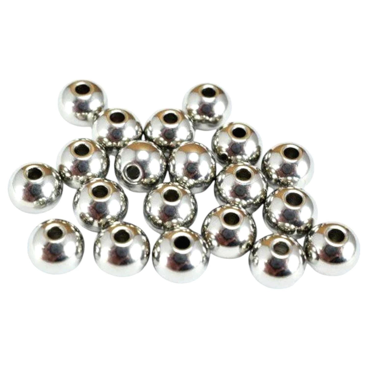 Macro shot of smooth stainless steel beads showing mirror-like polished finish