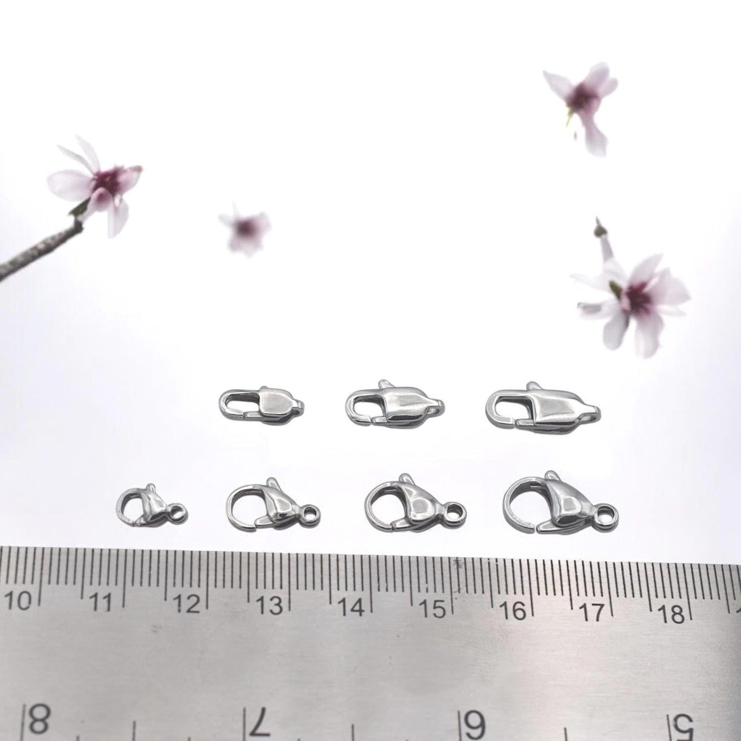 Silver lobster clasp paired with extender chain for adjustable jewelry length.
