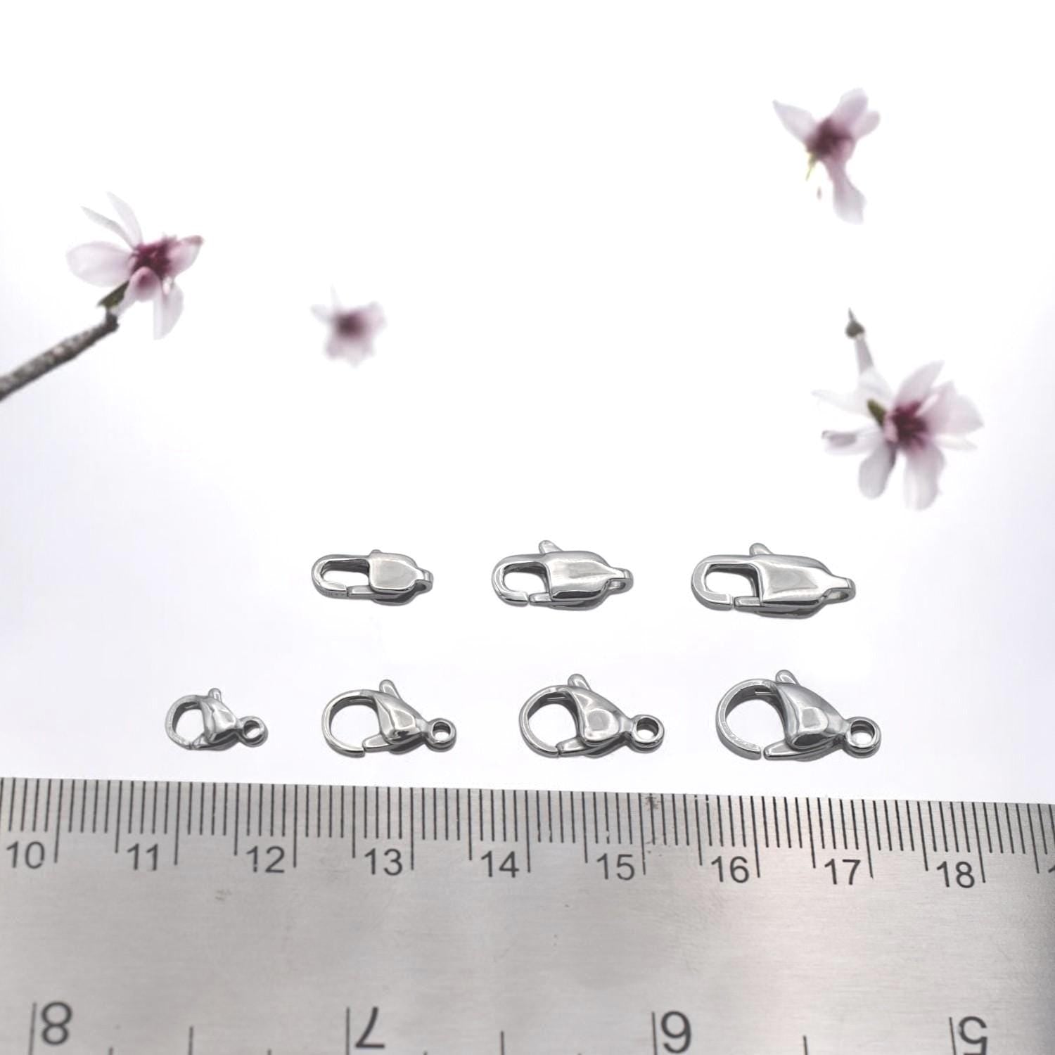Silver lobster clasp paired with extender chain for adjustable jewelry length.