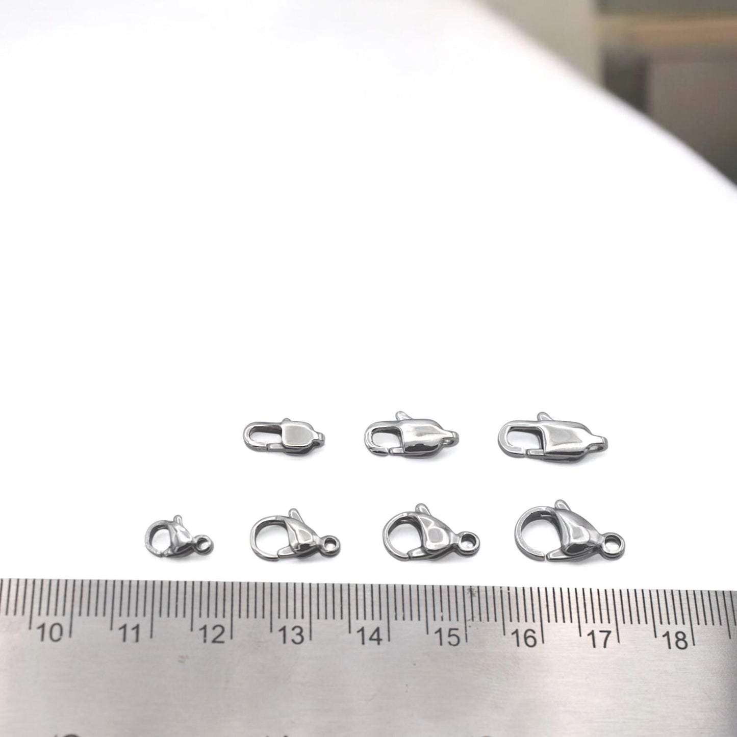 Stainless steel clasp mounted on product