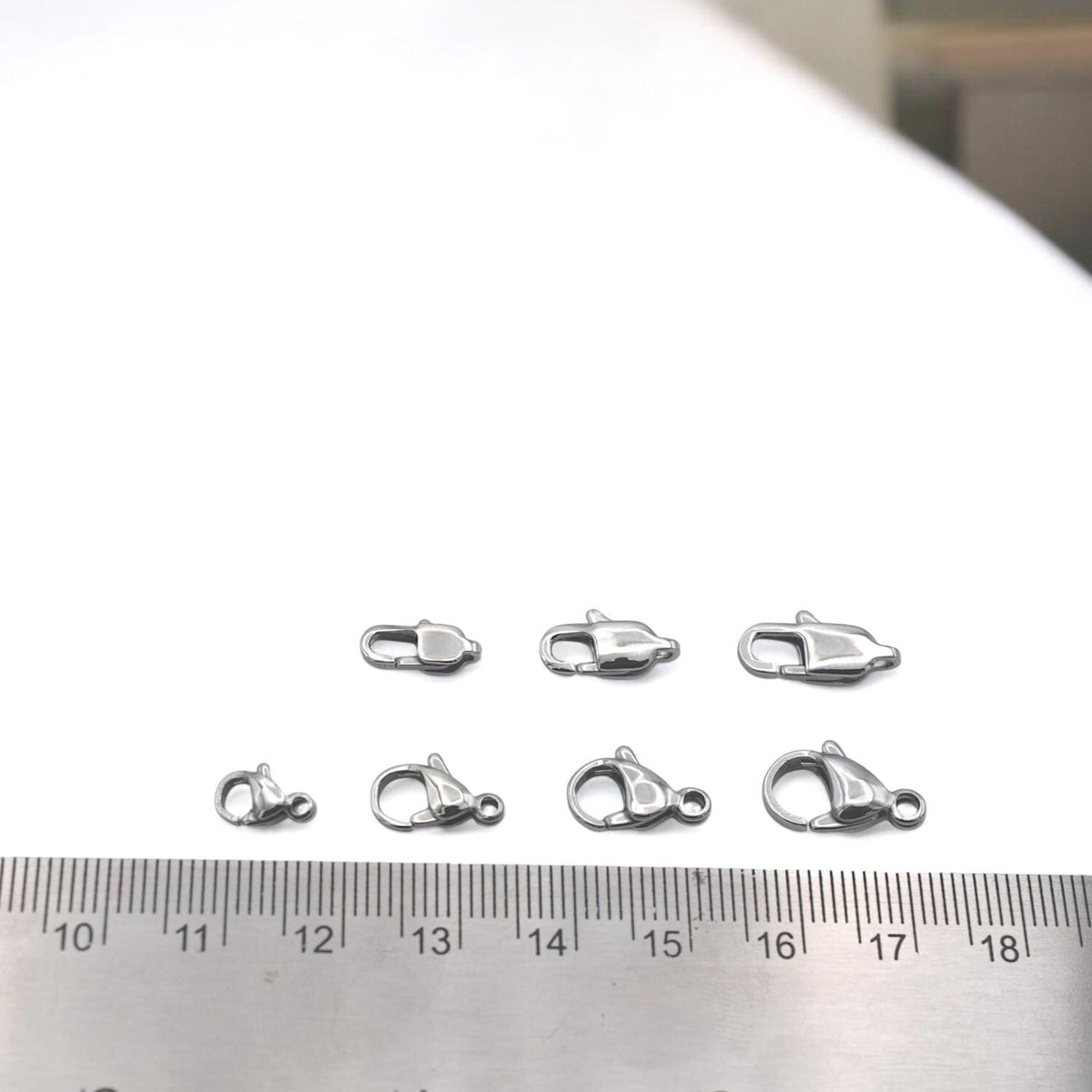 Stainless steel clasp mounted on product