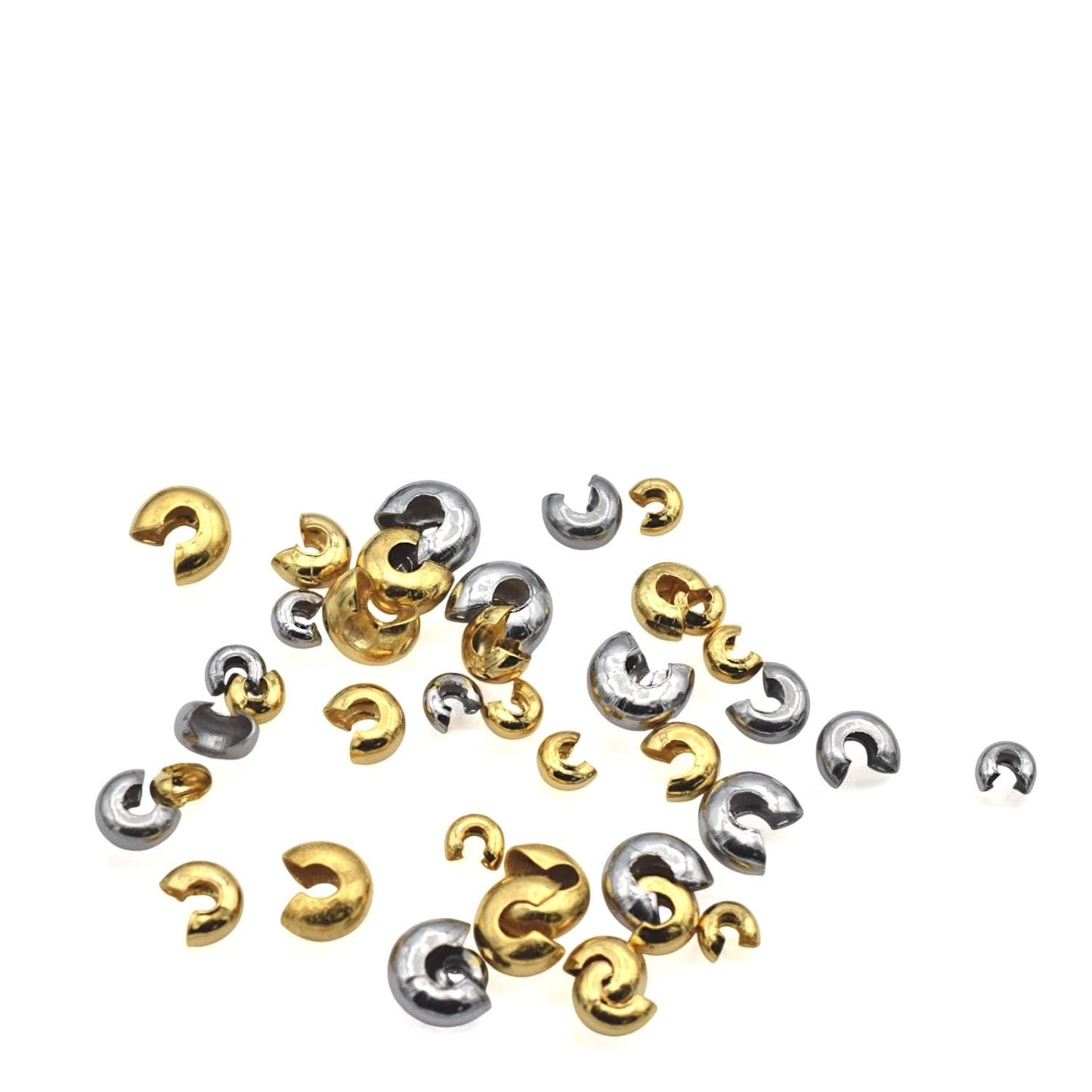 Macro shot of dome-shaped gold crimp cover with open gap, designed to snap over knots or crimp tubes.