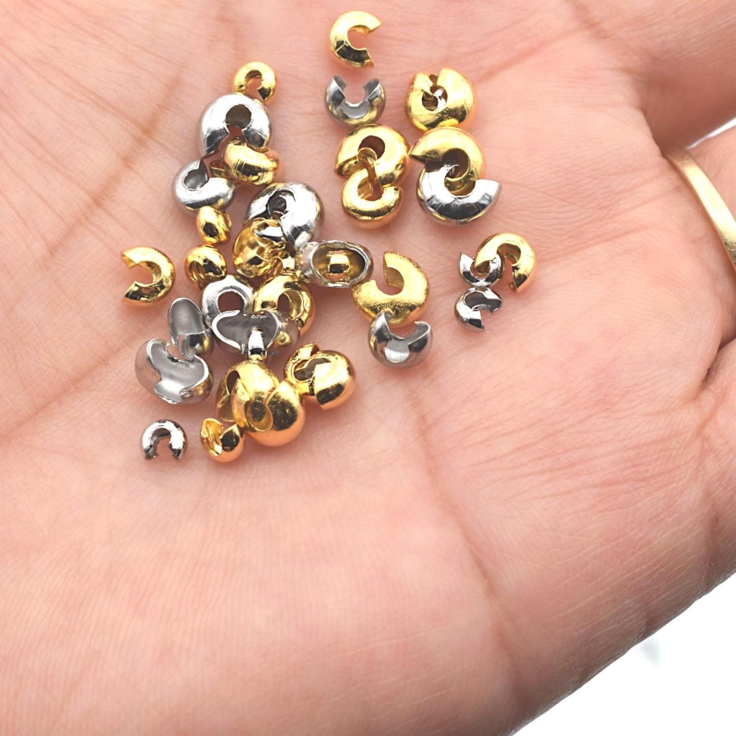 Gold dome bead covers shown on a scale chart with measurements, helping buyers choose the right size for their jewelry projects.