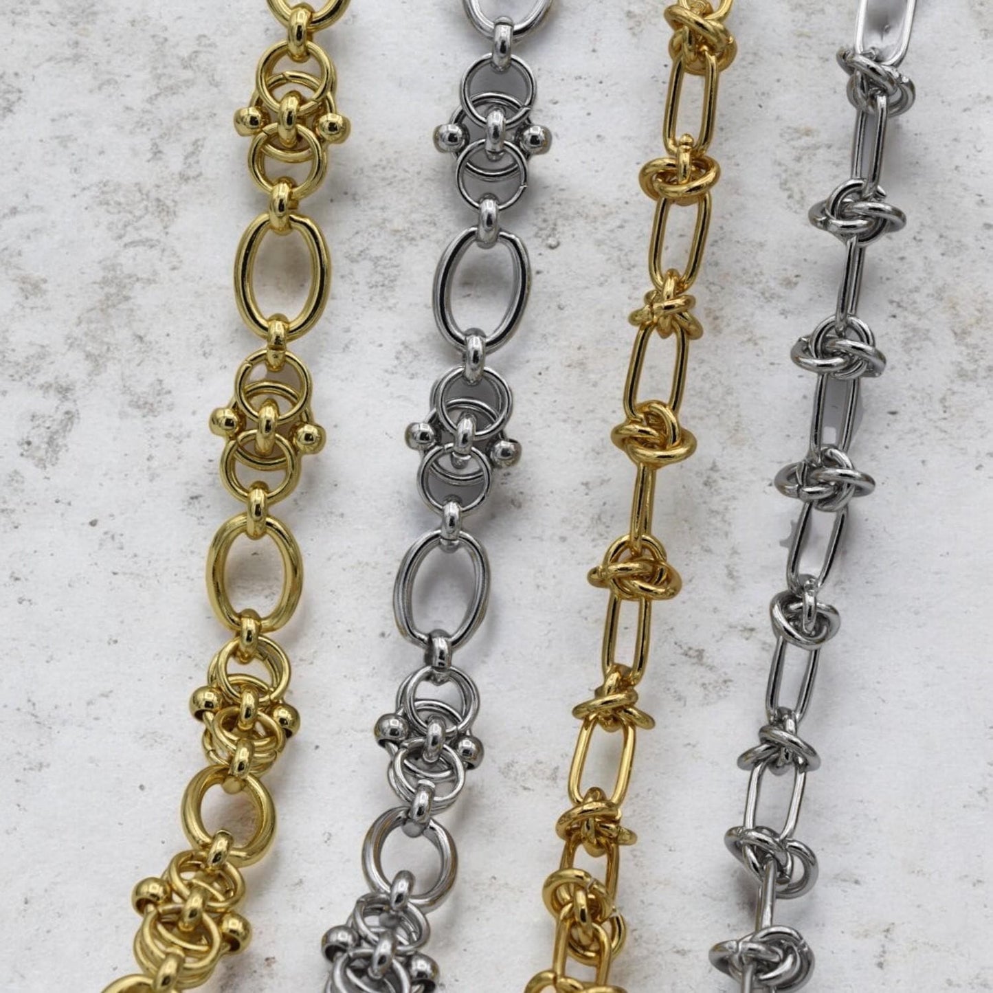 Mixed metal chains in gold and silver tones, showcasing knot and link variations for jewelry making.