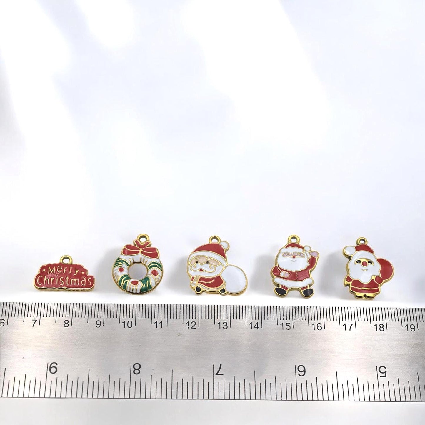 Holiday enamel charms set – Santa and wreath pendants in red, white, and gold stainless steel.