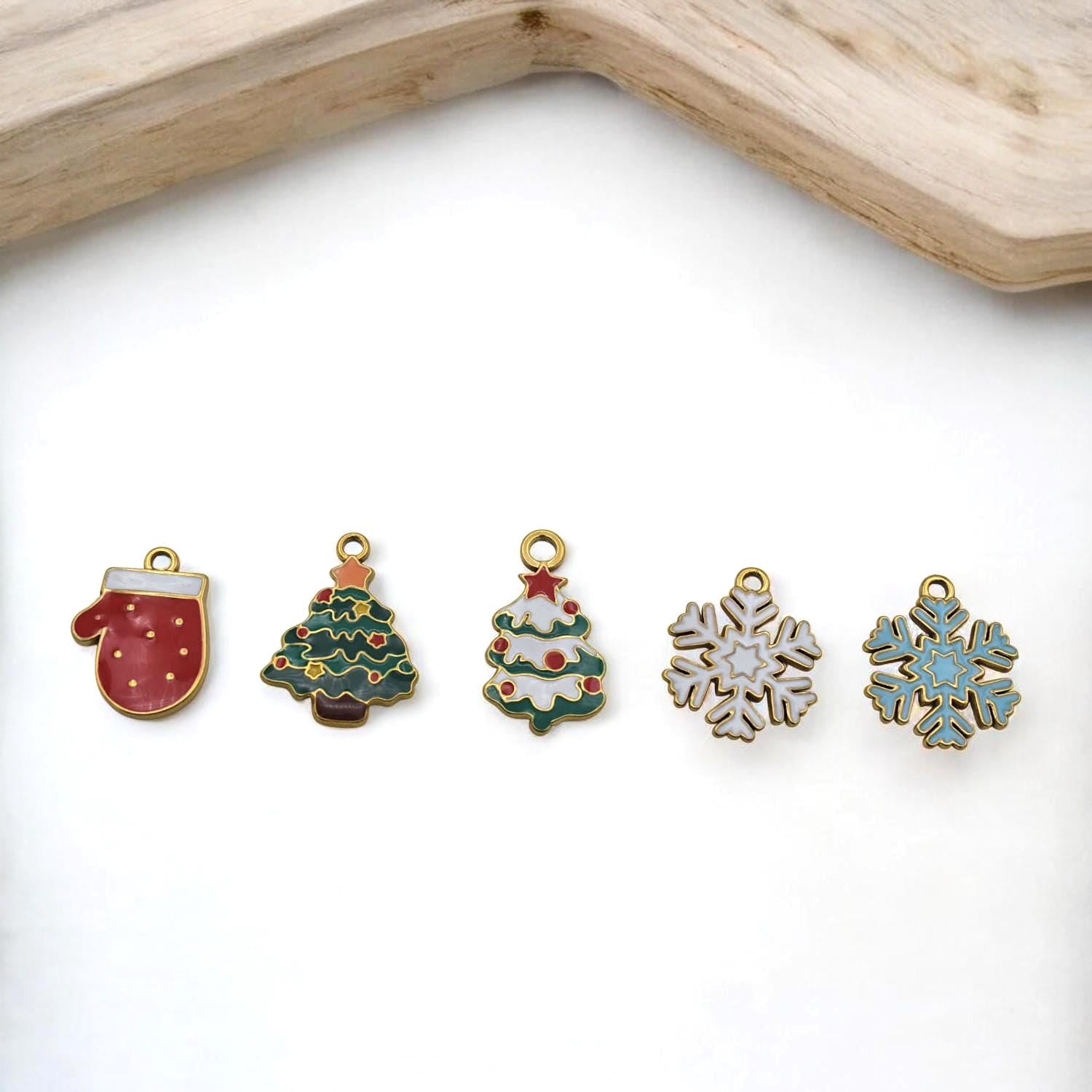 Holiday stainless steel enamel charms set – mitten and tree pendants in red, green, and gold.
