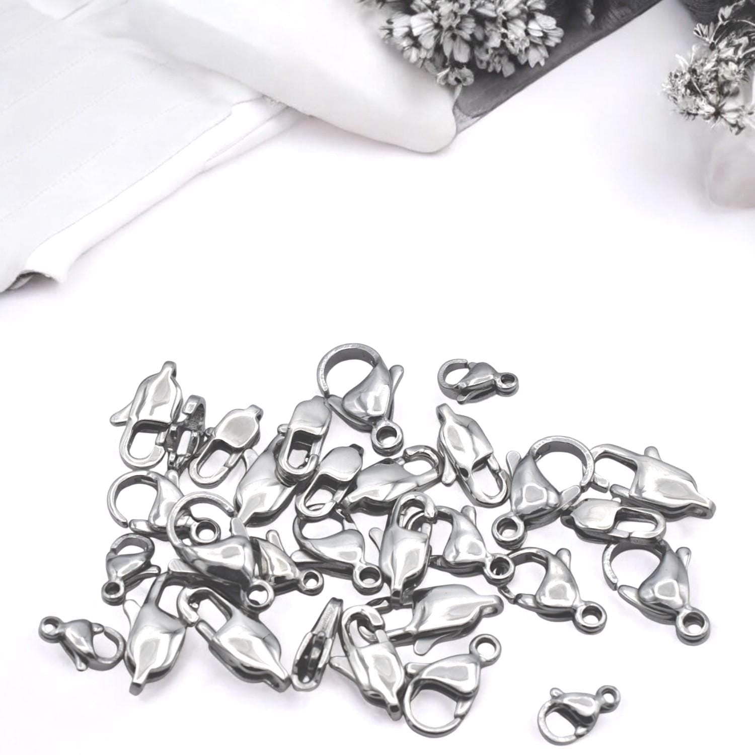 Bulk pack of stainless steel lobster clasps displayed in clear packaging for wholesale.