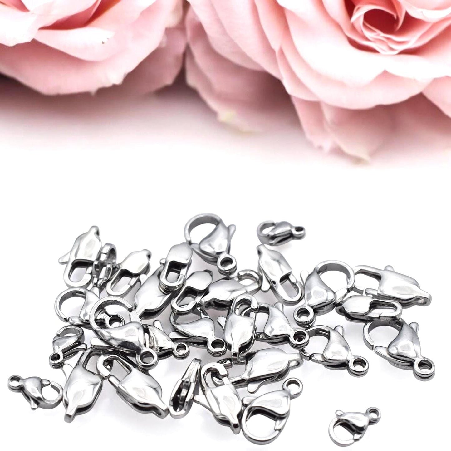 Group of lobster clasps in 6mm to 15mm sizes laid out for comparison.