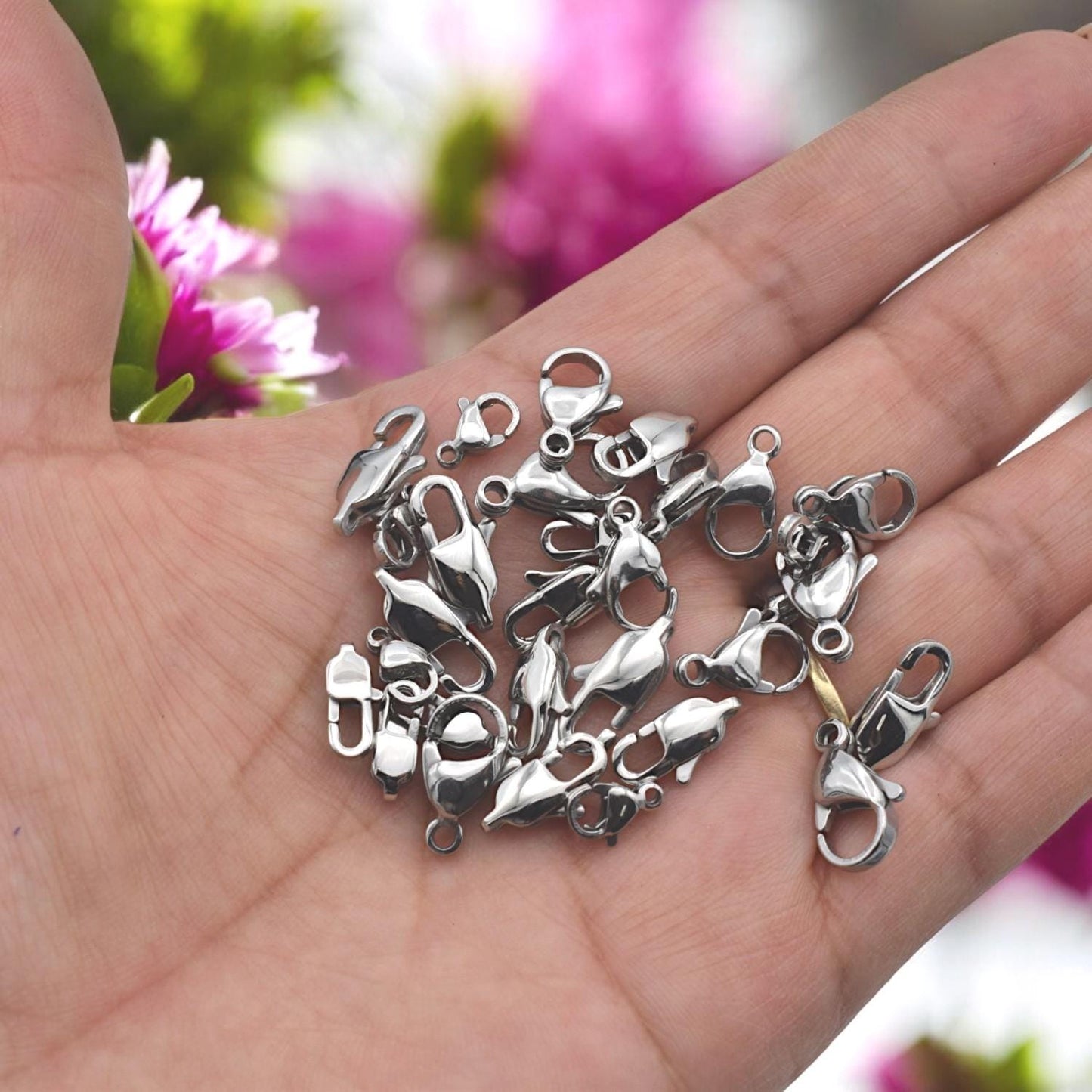 Polished stainless steel clasp on minimalist necklace, resting on model’s collarbone.