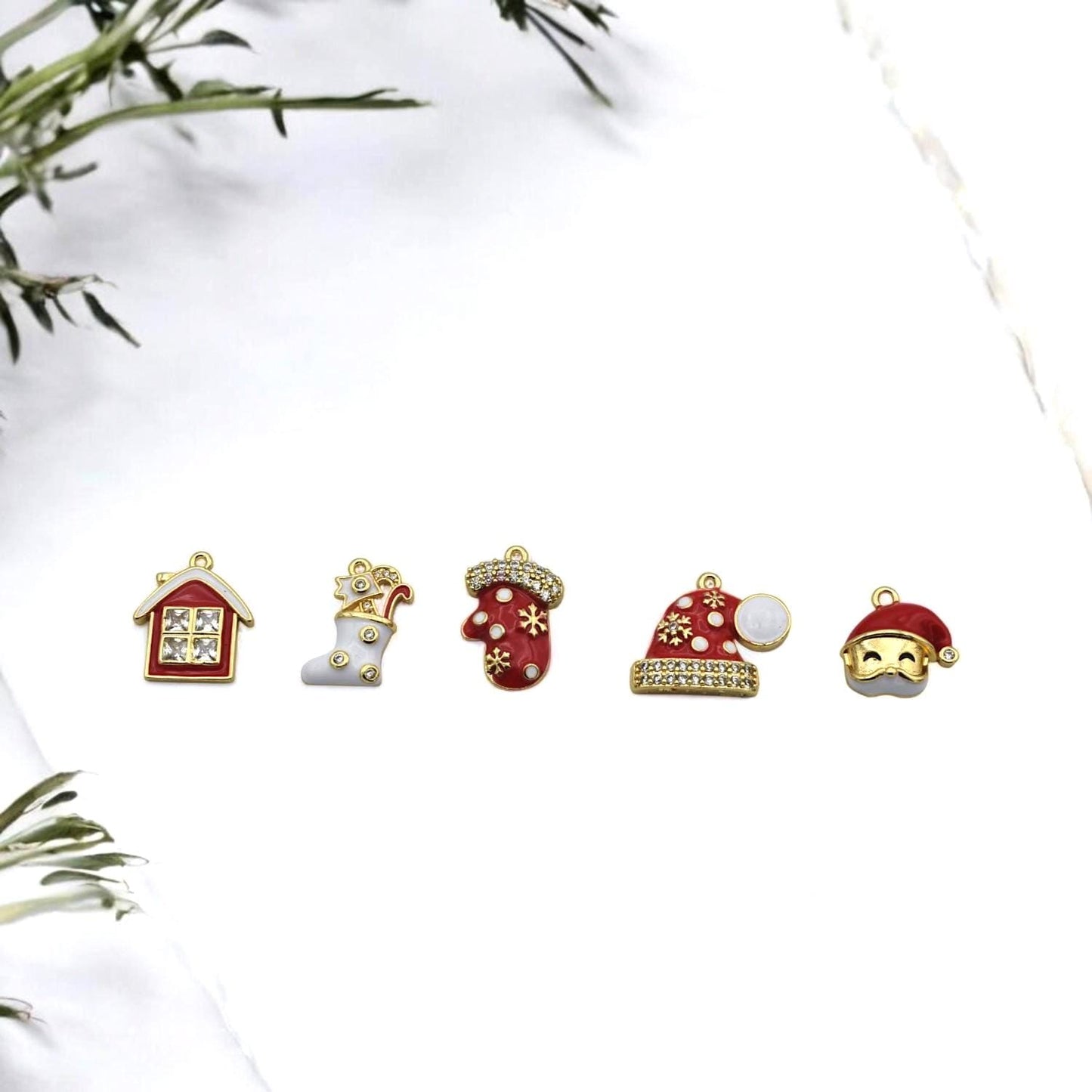 Red and white enamel charms with gold trim and rhinestones, perfect for Christmas jewelry making.