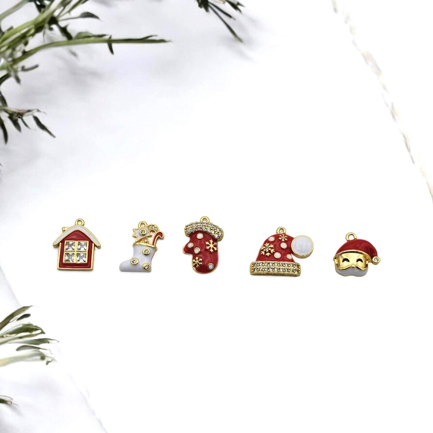 Red and white enamel charms with gold trim and rhinestones, perfect for Christmas jewelry making.