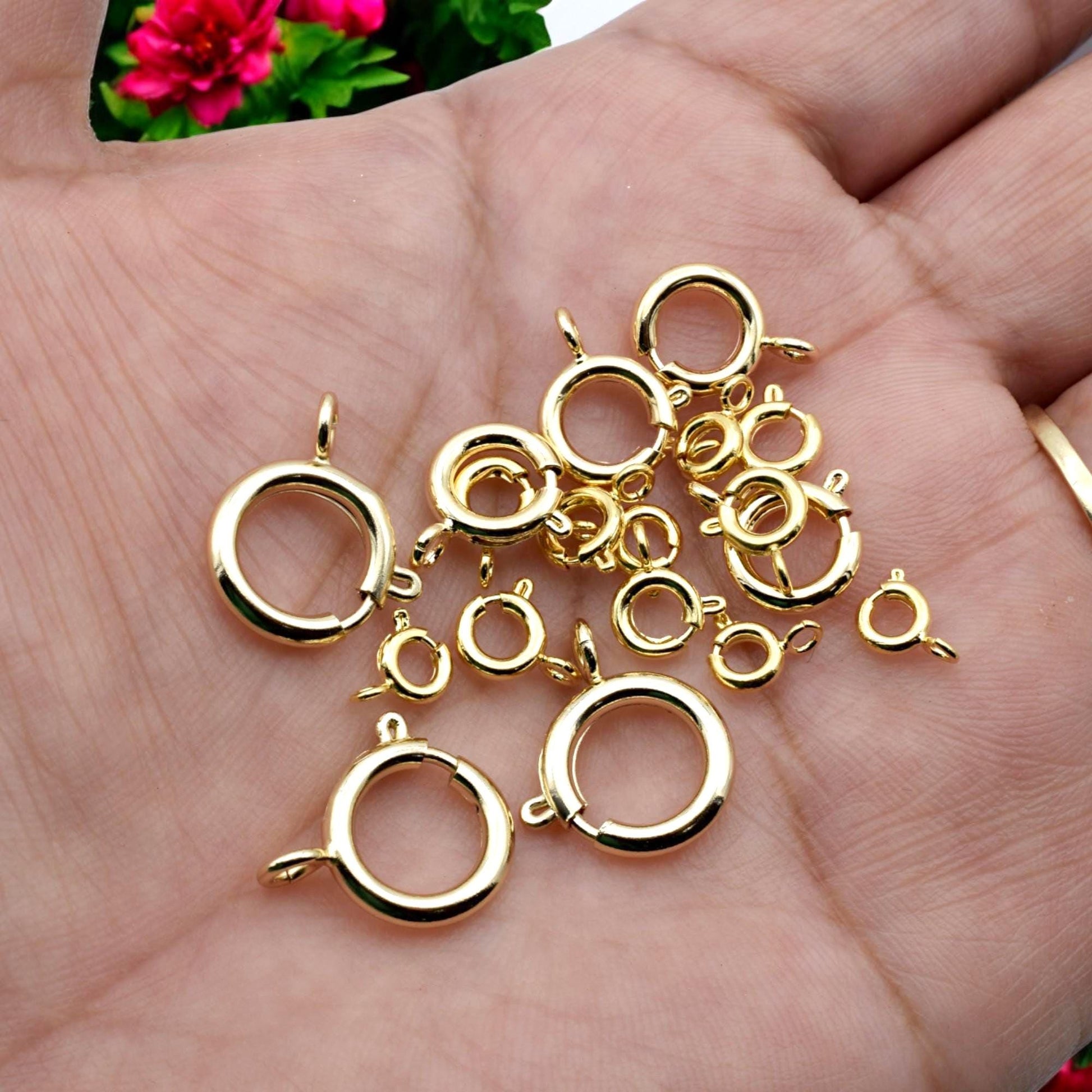 Macro shot of a gold-filled clasp locking mechanism, emphasizing durability and craftsmanship.