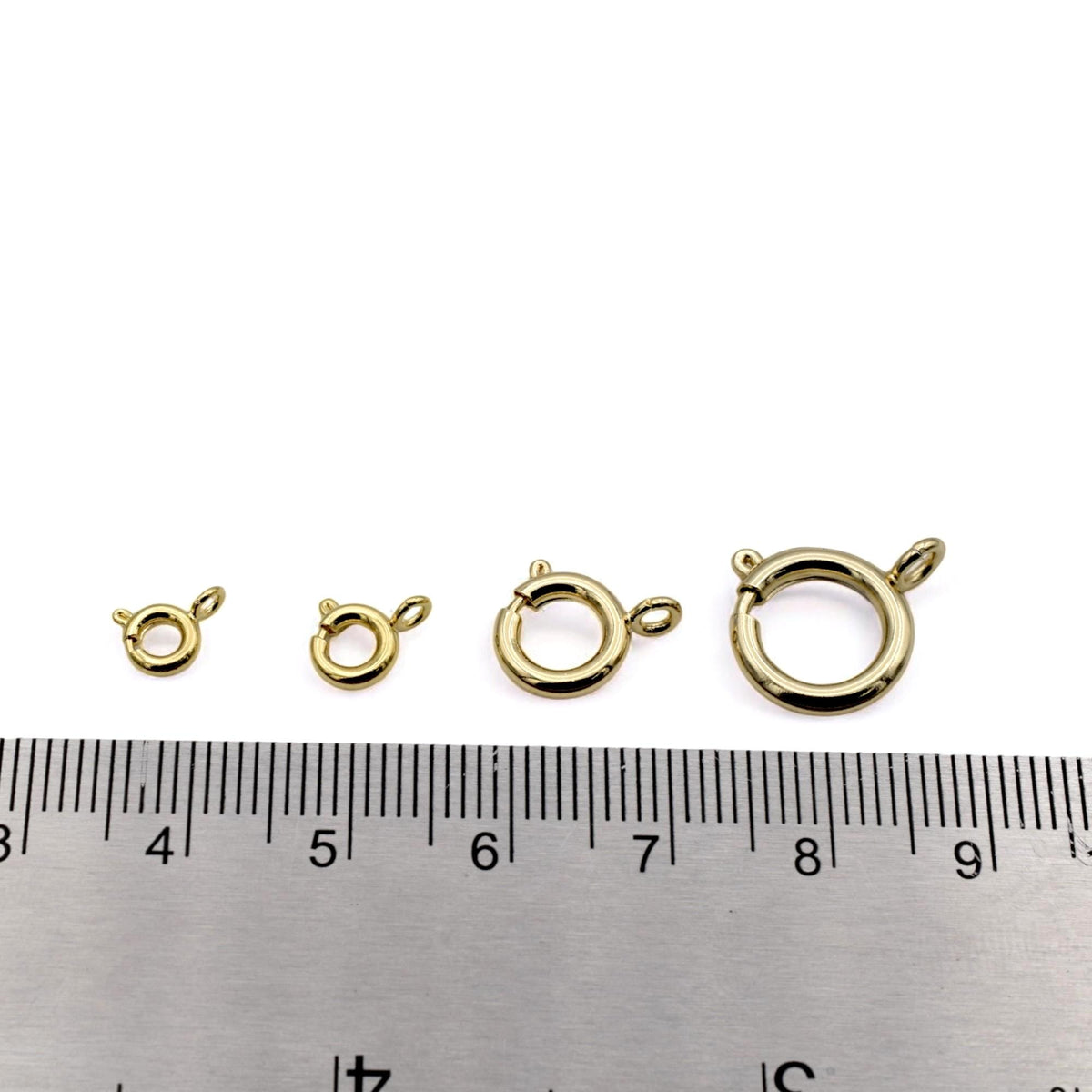 Group of gold-filled clasps displayed on a product card with size labels for jewelry supply listings.