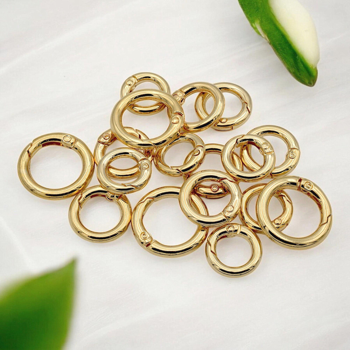 Gold-colored spring clasp with rotating hinge for handmade jewelry