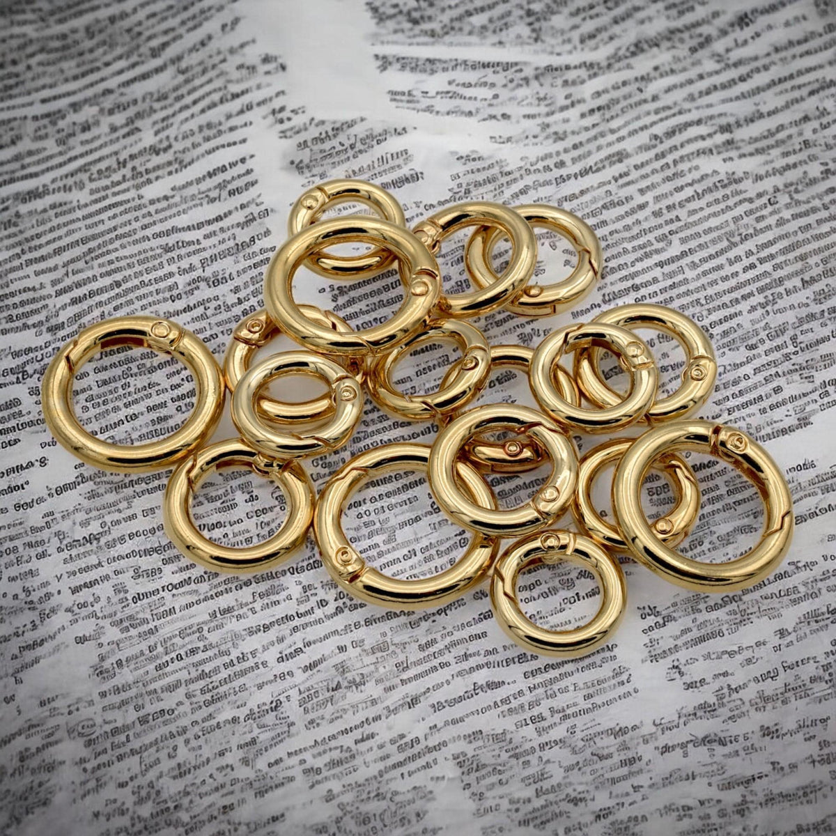 Versatile gold-tone connector ring with spring mechanism and swivel action