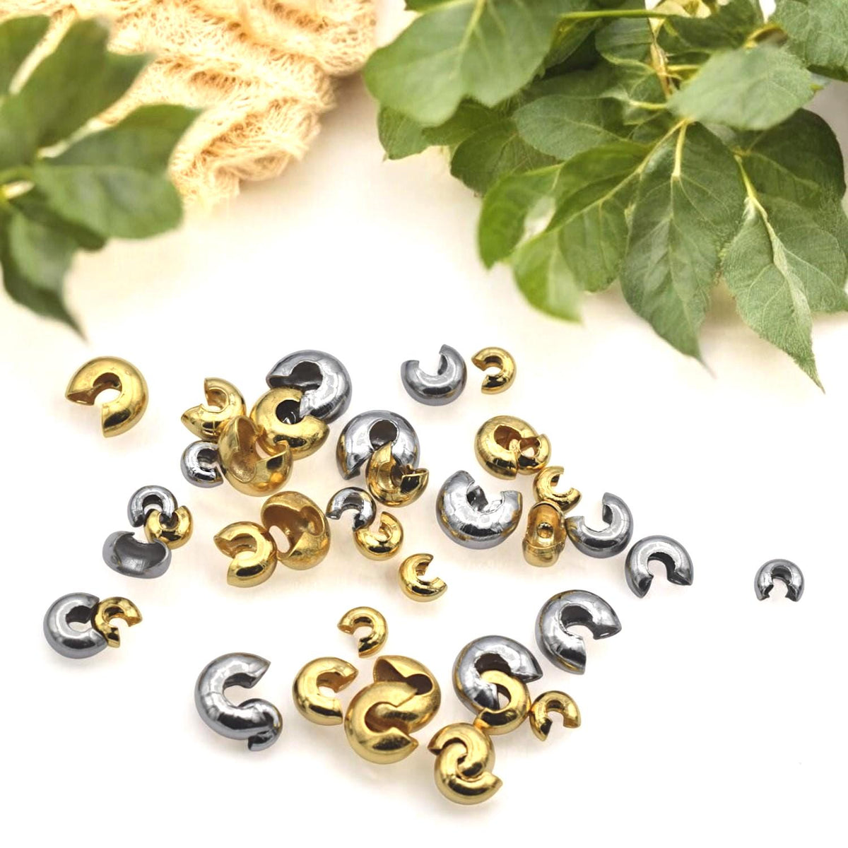 Gold stainless steel knot covers styled with finished beaded jewelry pieces, highlighting their polished look.