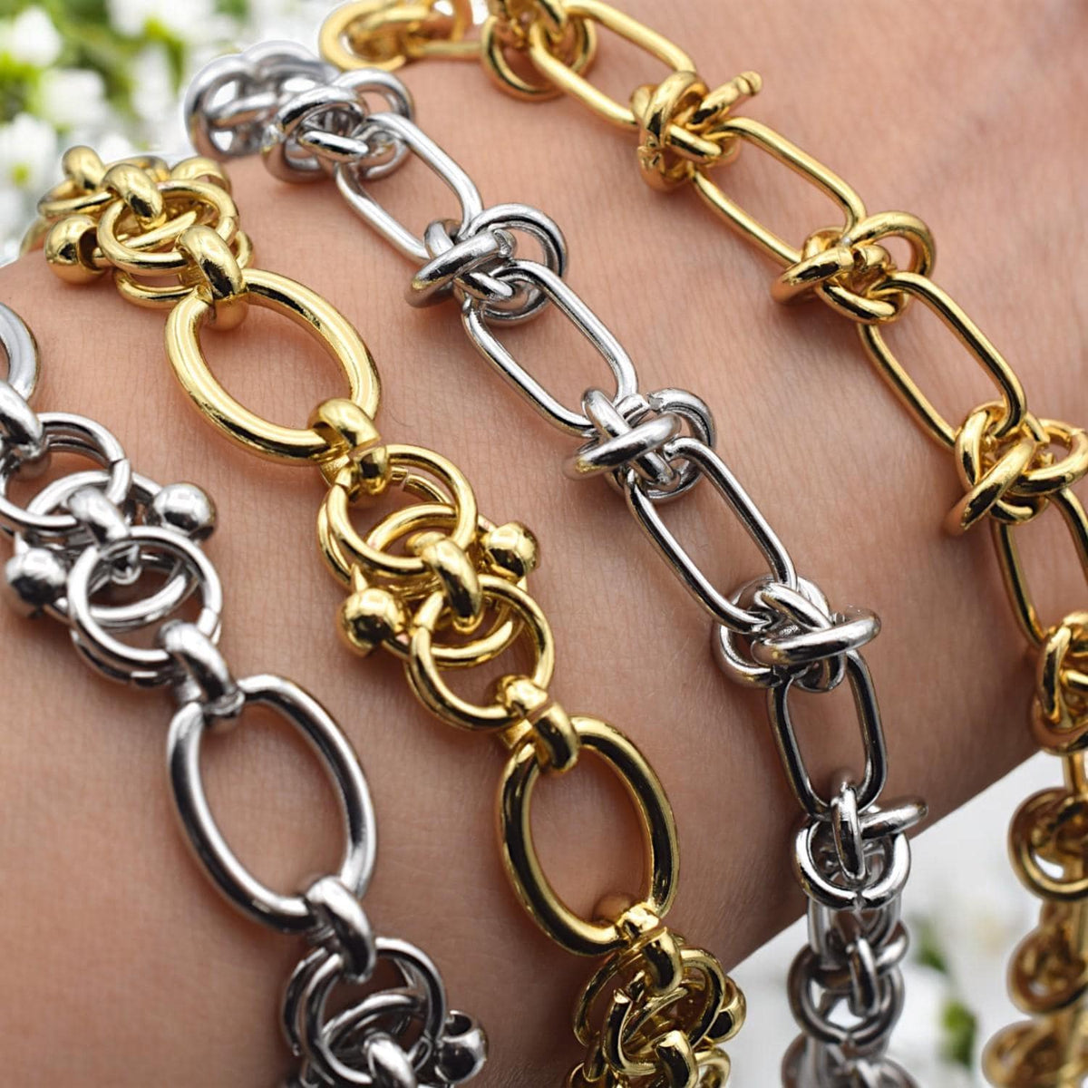 Silver chain with alternating knot and oval links, styled on a jewelry card for retail presentation.