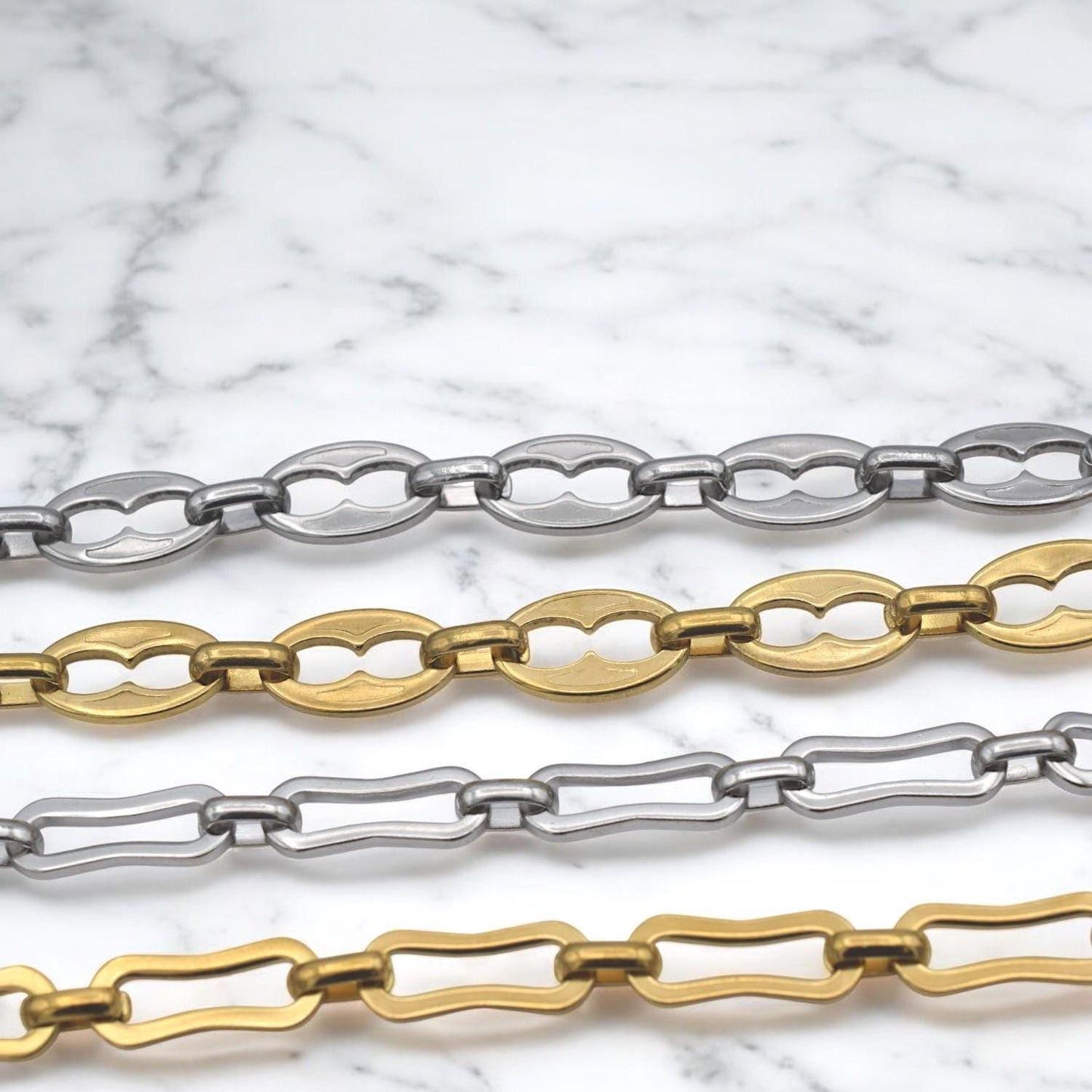 Rounded rectangle link chain with soft corners styled as purse handle chain