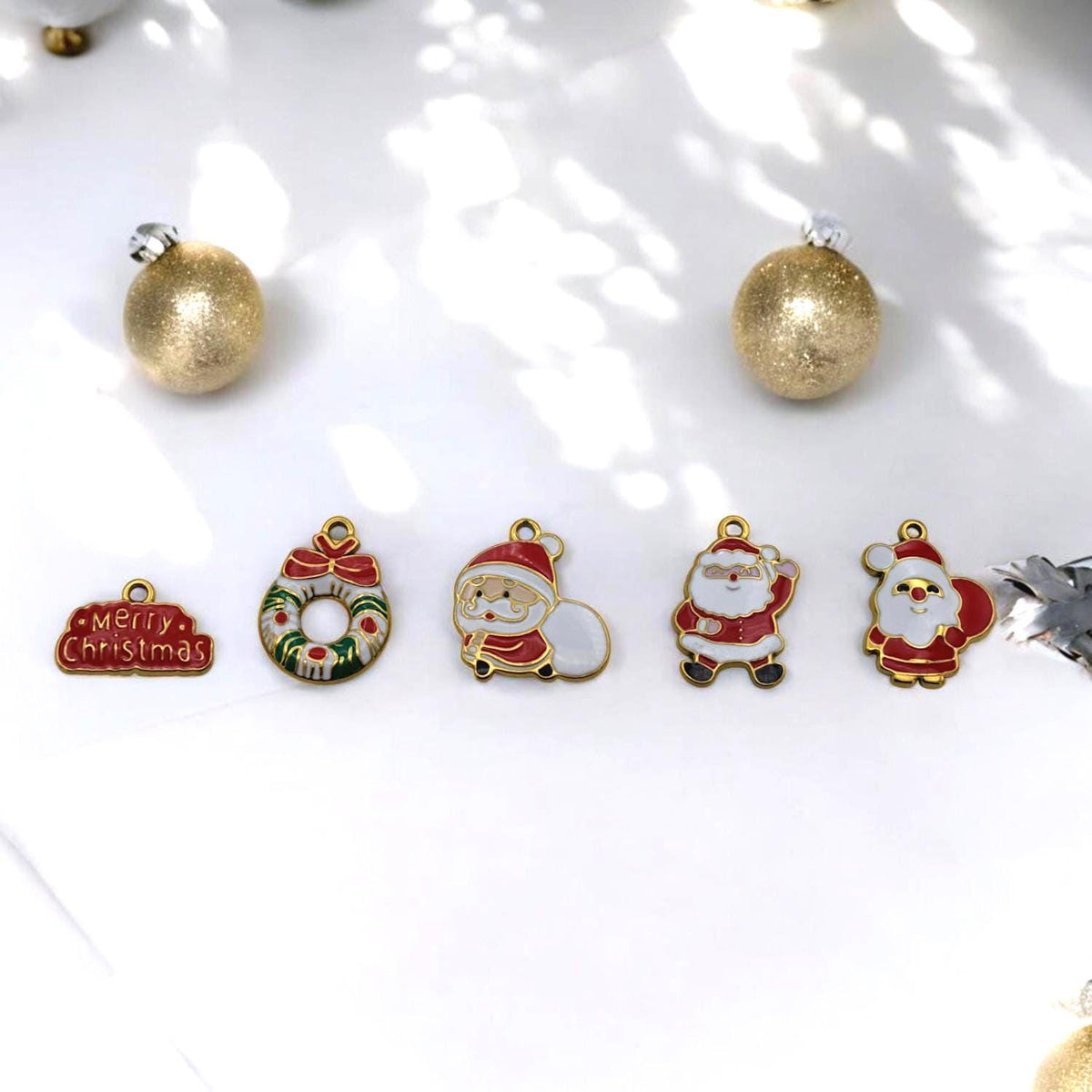 Festive enamel wreath charm with Merry Christmas text, stainless steel holiday pendant.