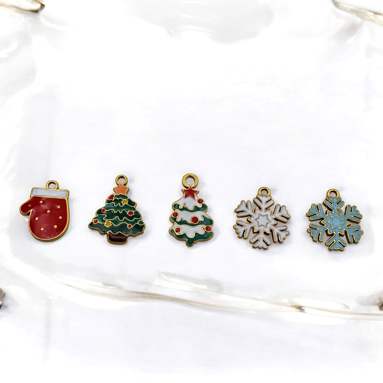 Christmas snowflake enamel charm in stainless steel, white and gold-tone pendant for jewelry.