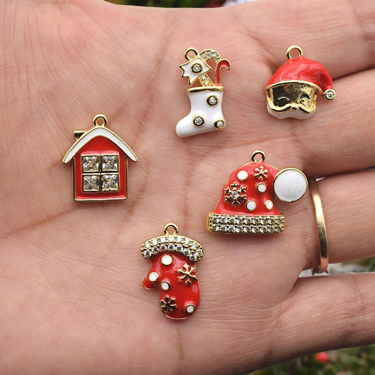 Christmas-themed bead charms in festive colors, ideal for DIY jewelry and holiday craft projects.