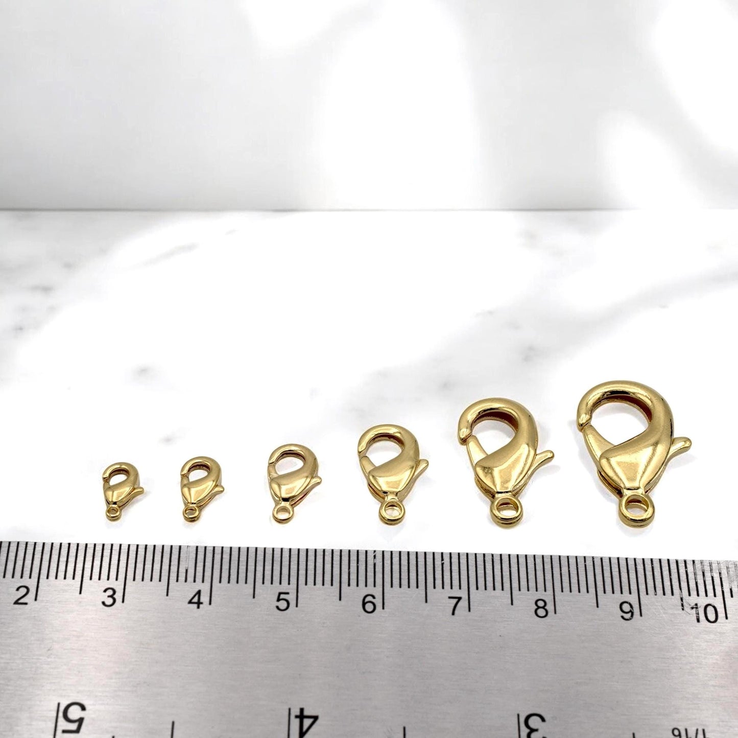 Set of multiple lobster clasps in assorted sizes from 4x9mm to 12x23mm