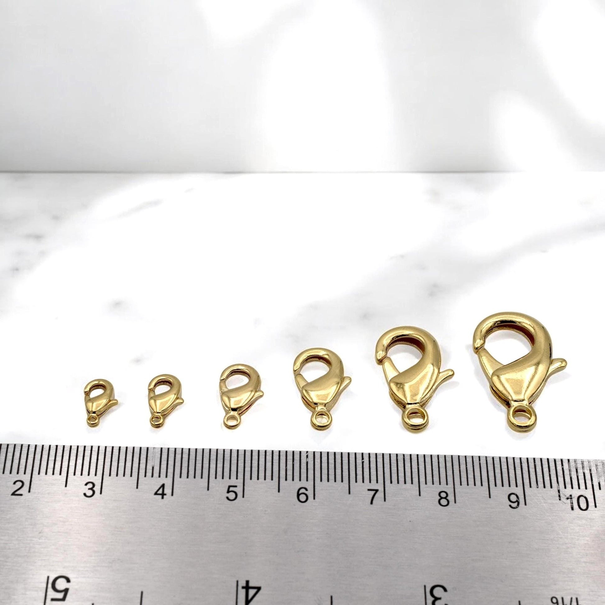 Set of multiple lobster clasps in assorted sizes from 4x9mm to 12x23mm