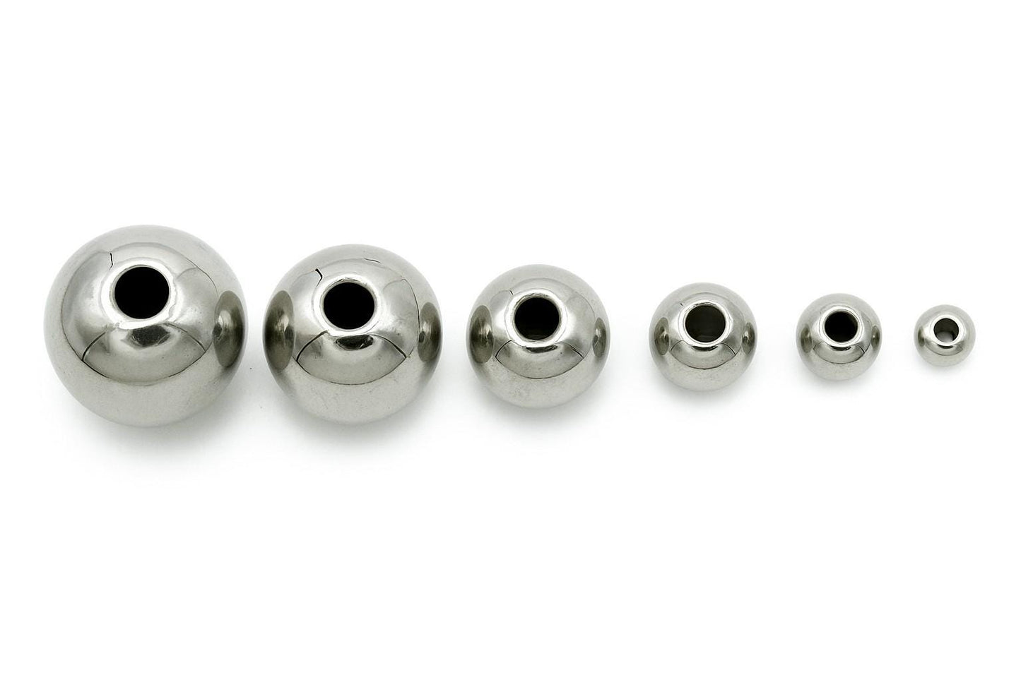 Set of plain silver-tone stainless steel beads arranged in rows from 2mm to 12mm
