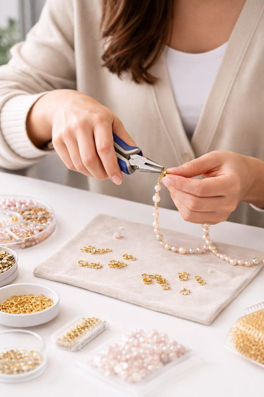 Flat nose pliers holding a small jewelry component to show precision control
