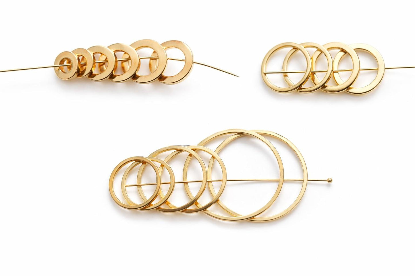 Gold Filled Look square jump rings in assorted sizes displayed on white background