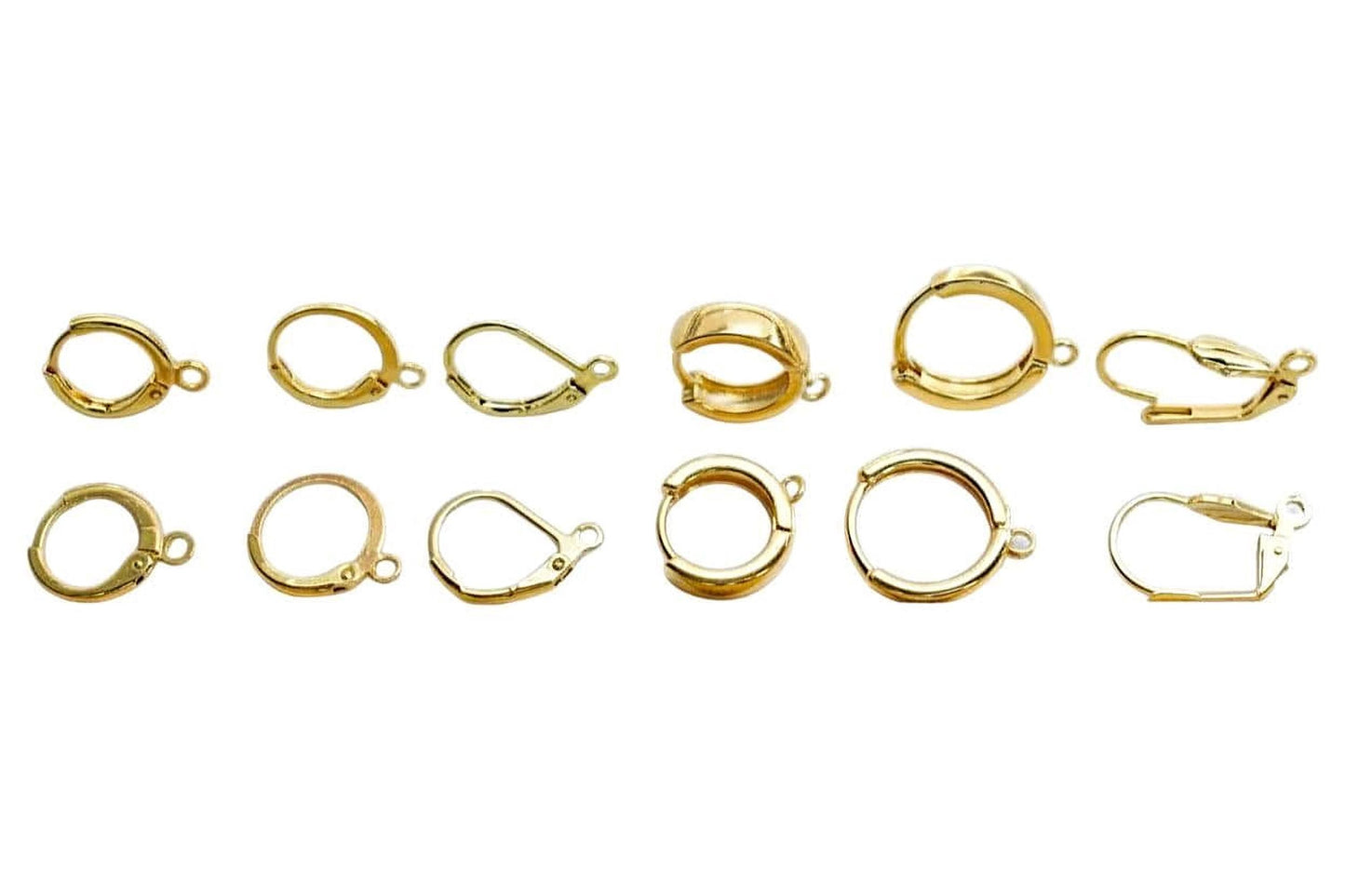 a collection of various gold-colored earring hooks and earring backs, showcasing different designs and styles.