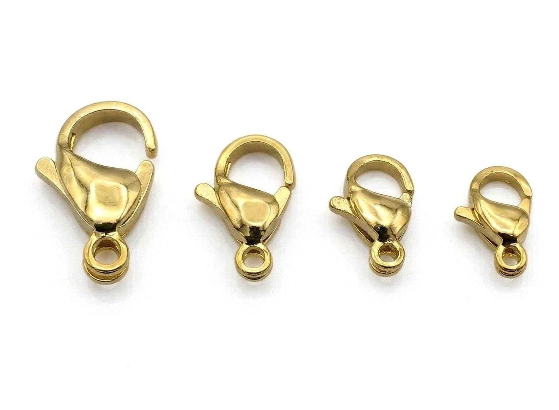 a collection of gold-colored lobster clasp locklets arranged in a row.