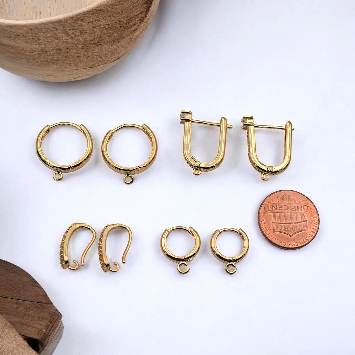 An extreme close-up focusing on the small, seamless loop at the base of the hoop, specifically for attaching charms and dangles.