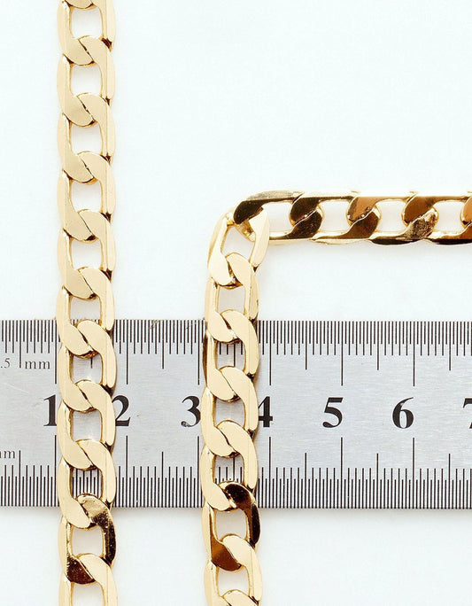 two gold chain necklaces placed next to a ruler for size comparison.