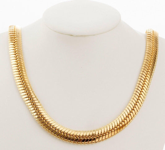A gold-colored necklace with a long, continuous chain design.