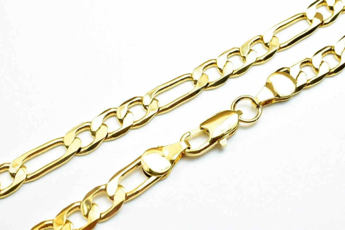 A close-up image of a gold chain necklace with a clasp and a clasp lock.