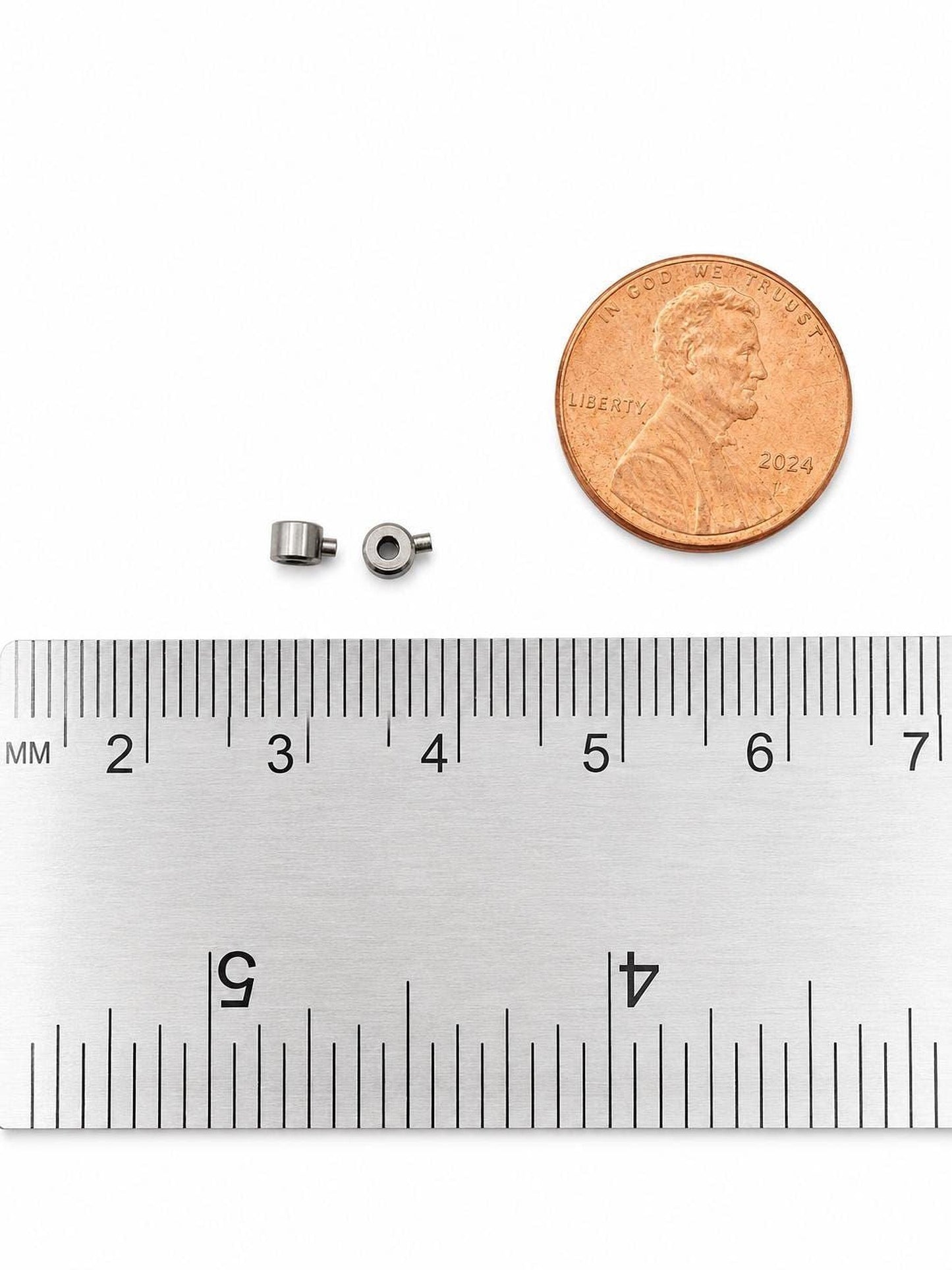 Stainless steel end locker crimp connectors shown beside a ruler for jewelry making size reference.