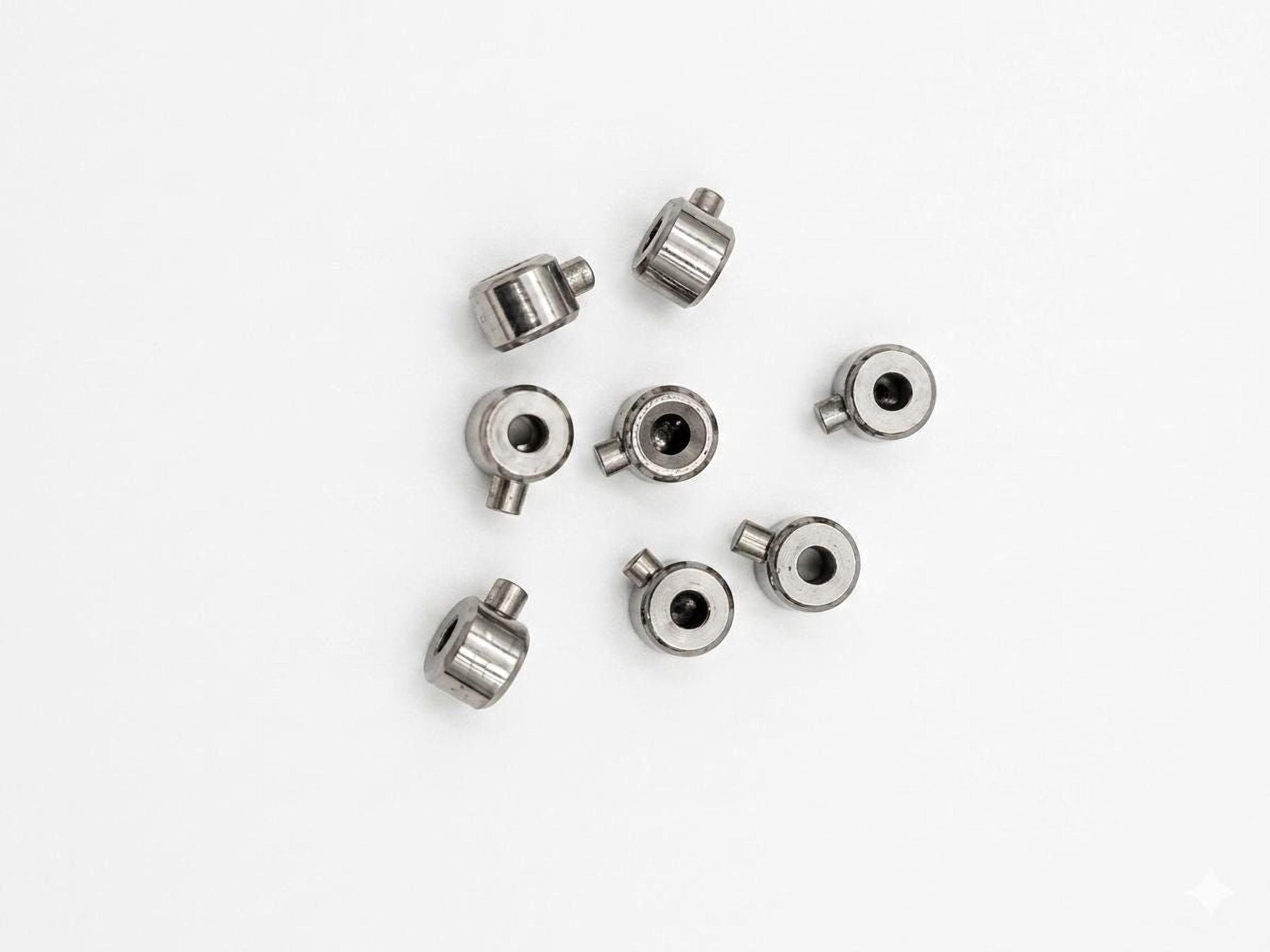 Small round stainless steel crimp end connectors for jewelry repair and DIY bracelet making.