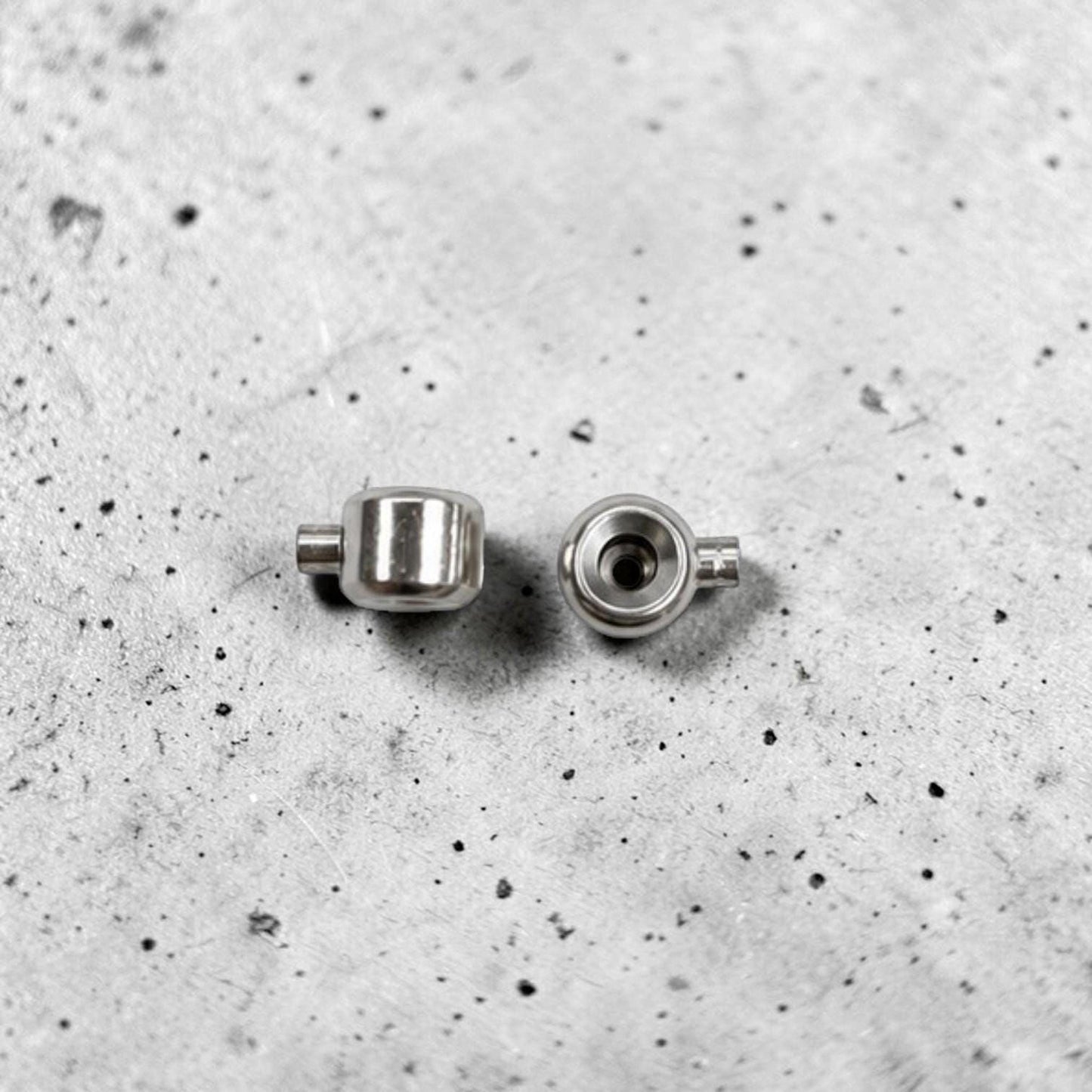 Stainless steel jewelry findings for securing cord ends on necklaces, bracelets, and anklets.